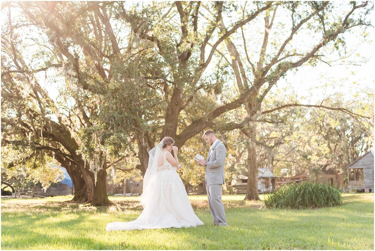 Couple exchanging private vows before ceremony at Destrehan Plantation wedding
