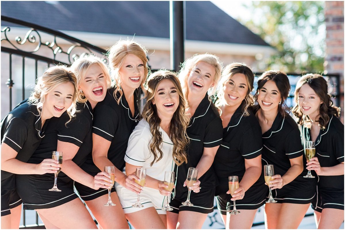 Bride and bridesmaids in matching pajamas before wedding in Kenner