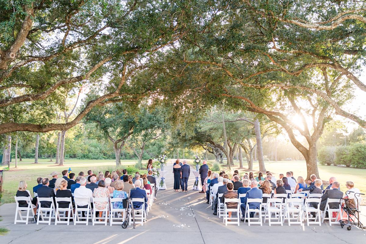 Wedding ceremony in front of Ellendale Country Club